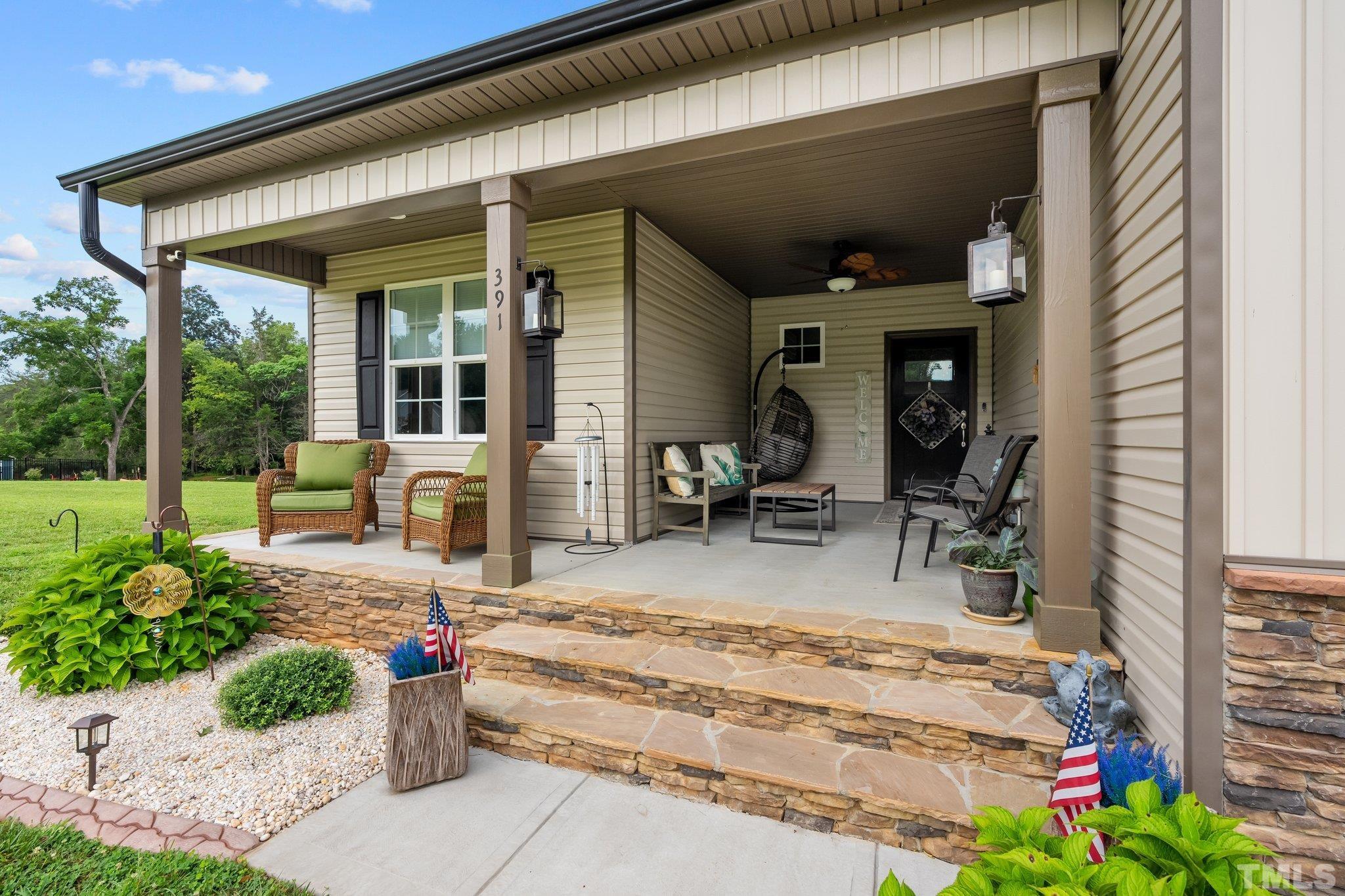 391 River Ridge Lane Timberlake, NC 27583 - Photo 5 of 47 a view of a entryway door front of house