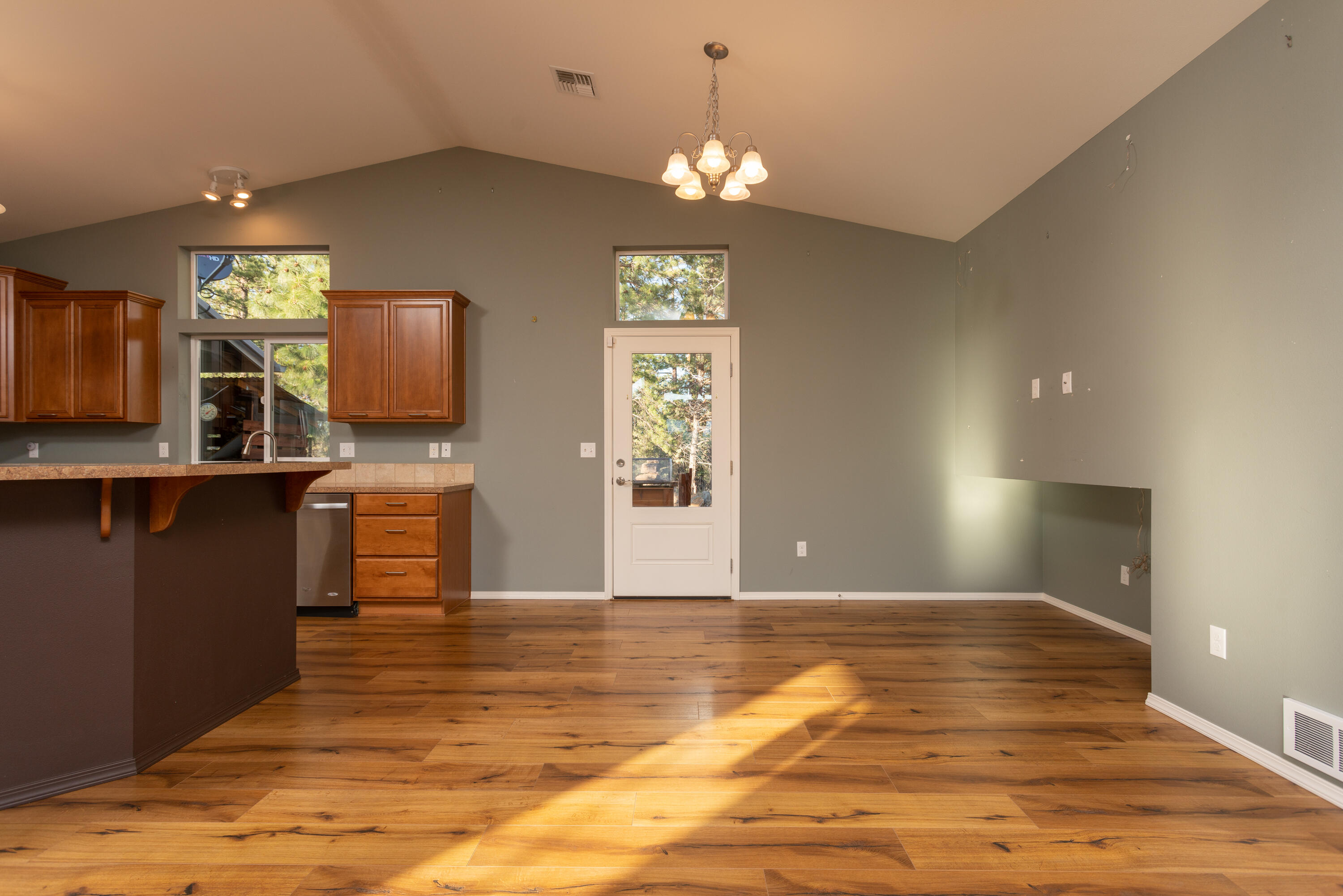 70099 Indian Ford Road Sisters, OR 97759 - Photo 13 of 27 a view of an empty room with window and wooden floor
