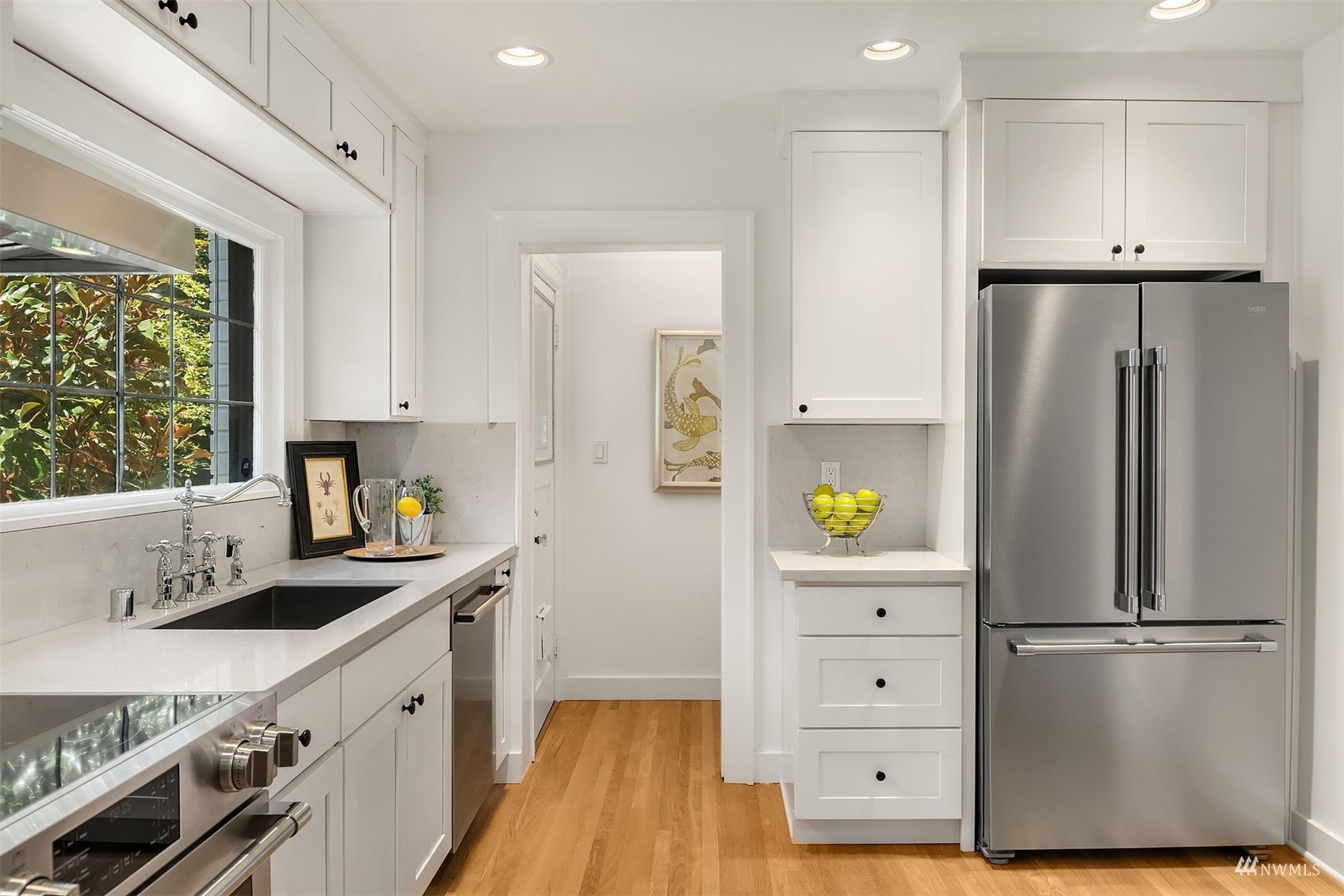 732 36th Avenue Seattle, WA 98122 - Photo 11 of 37 a kitchen with a refrigerator and a stove