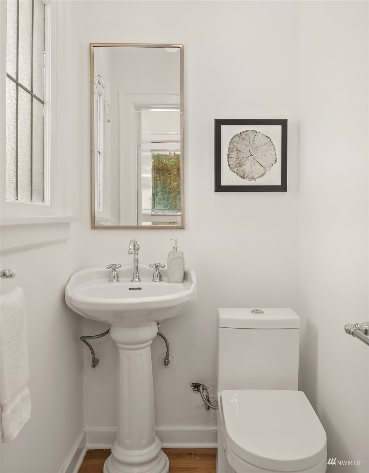 732 36th Avenue Seattle, WA 98122 - Photo 14 of 37 a bathroom with a toilet sink and mirror