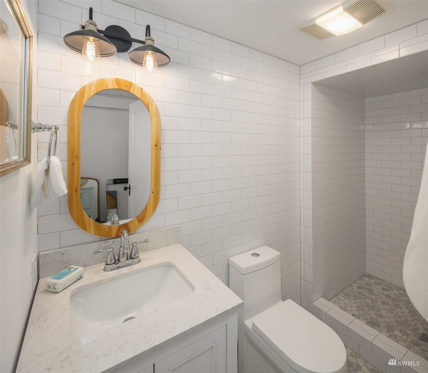 732 36th Avenue Seattle, WA 98122 - Photo 28 of 37 a bathroom with a sink mirror vanity and toilet
