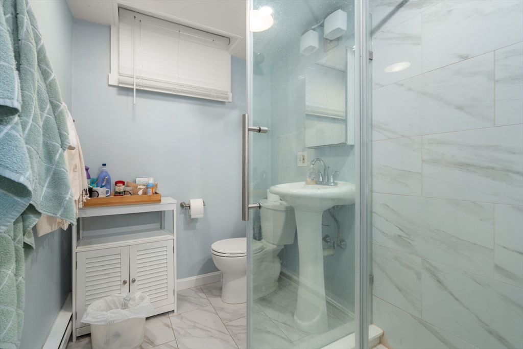 343 Harvard Street Cambridge, MA 02138 - Photo 11 of 41 a bathroom with a sink toilet and shower