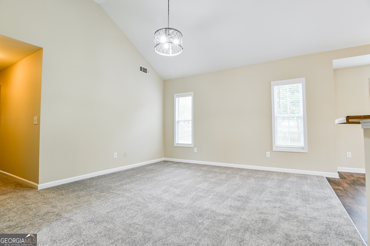 1766 Laurel Ridge Drive Southwest Conyers, GA 30094 - Photo 13 of 61 an empty room with windows