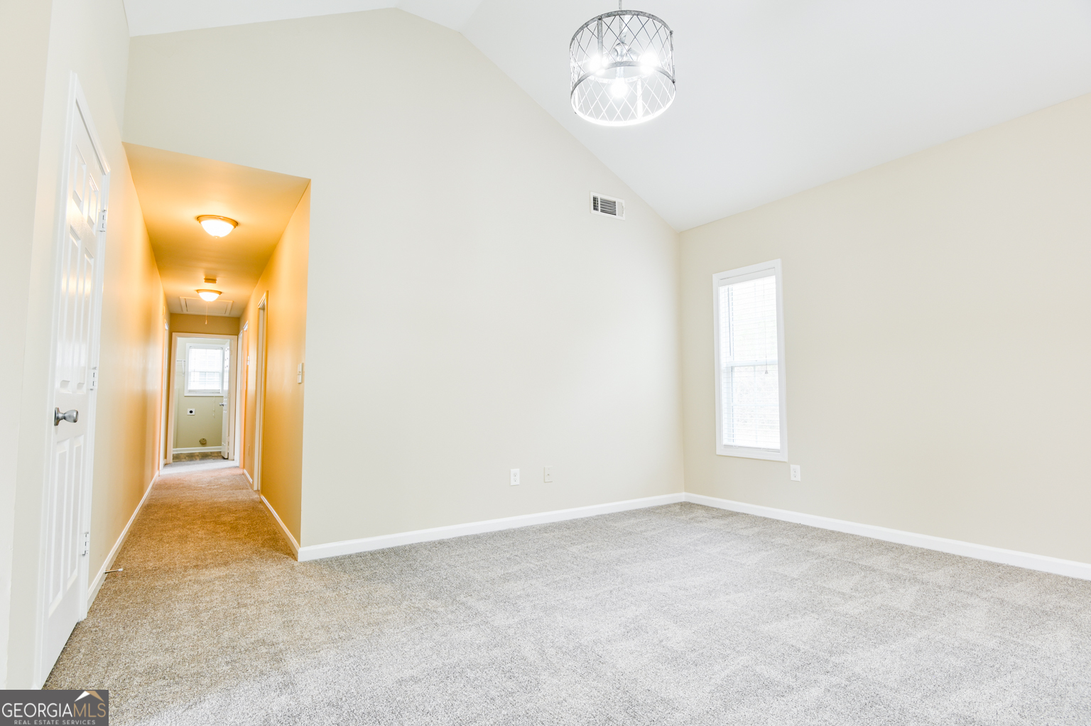 1766 Laurel Ridge Drive Southwest Conyers, GA 30094 - Photo 14 of 61 an empty room with windows and entrance