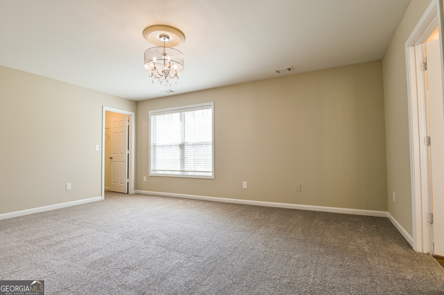 1766 Laurel Ridge Drive Southwest Conyers, GA 30094 - Photo 15 of 61 an empty room with a window