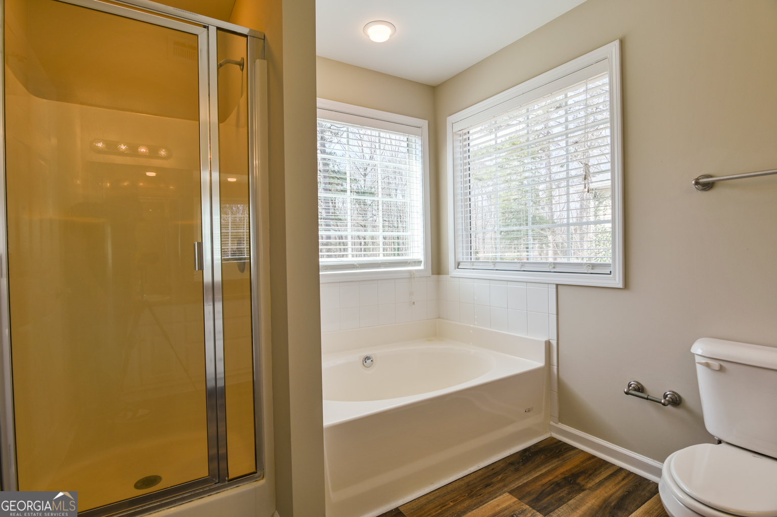 1766 Laurel Ridge Drive Southwest Conyers, GA 30094 - Photo 20 of 61 a bathroom with a bathtub and a shower
