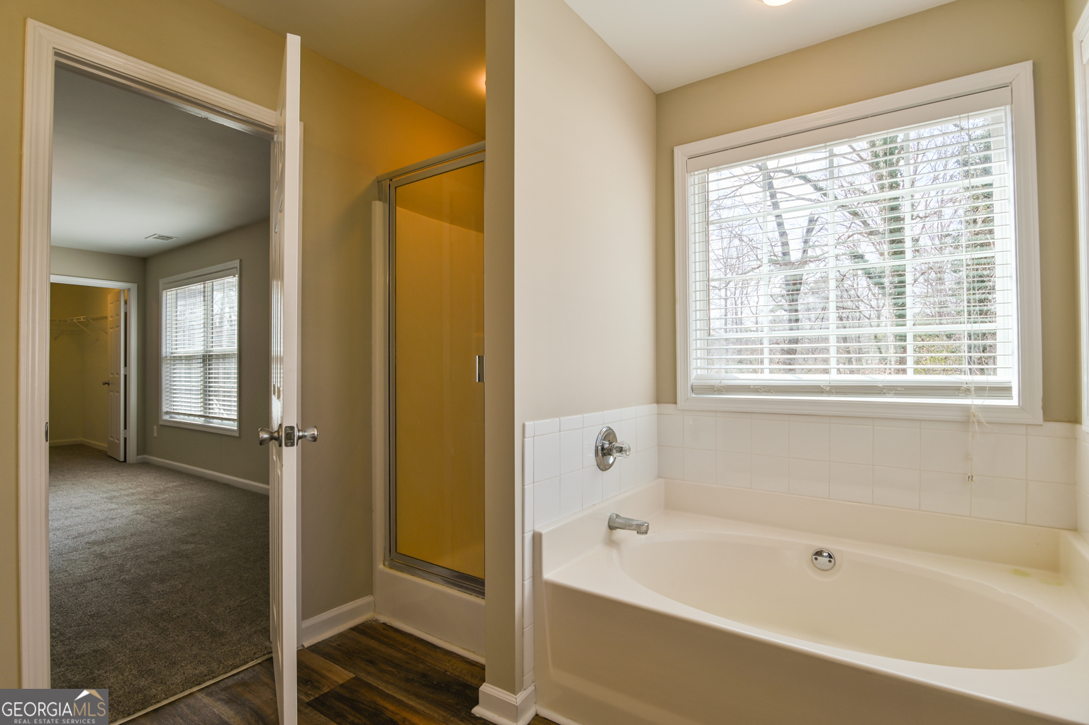 1766 Laurel Ridge Drive Southwest Conyers, GA 30094 - Photo 21 of 61 a bathroom with a bathtub and shower