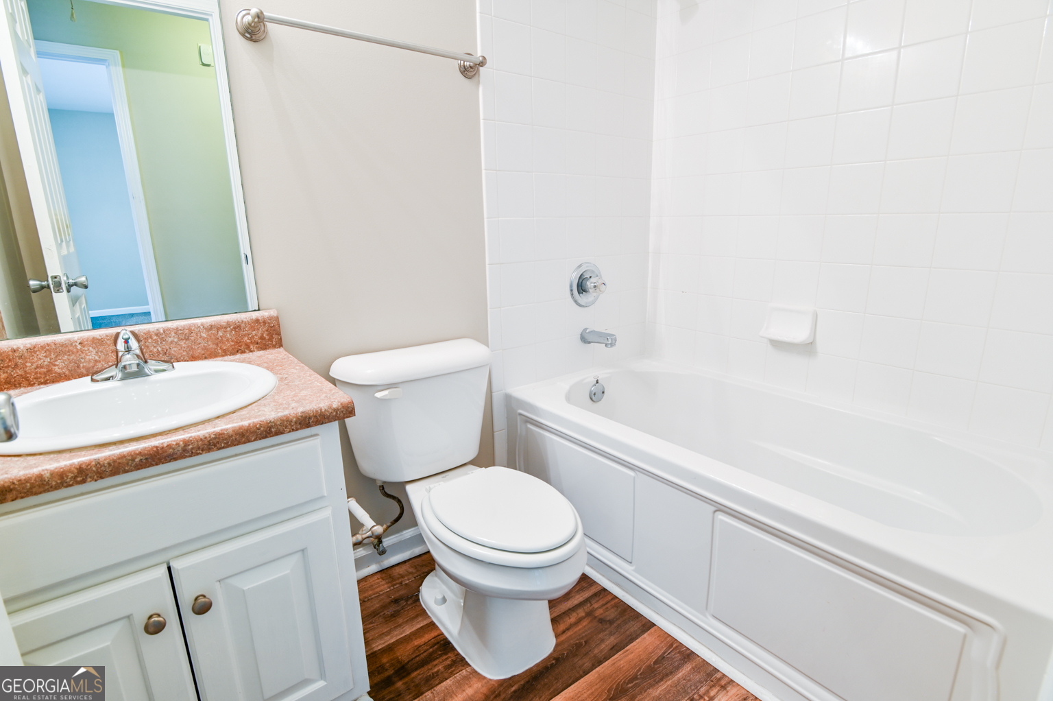 1766 Laurel Ridge Drive Southwest Conyers, GA 30094 - Photo 24 of 61 a white toilet sitting next to a bath tub
