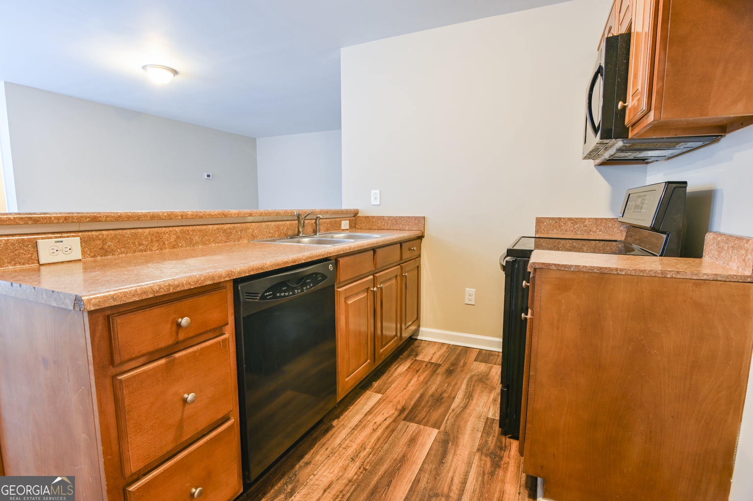 1766 Laurel Ridge Drive Southwest Conyers, GA 30094 - Photo 31 of 61 a utility room with wooden floor washer and dryer