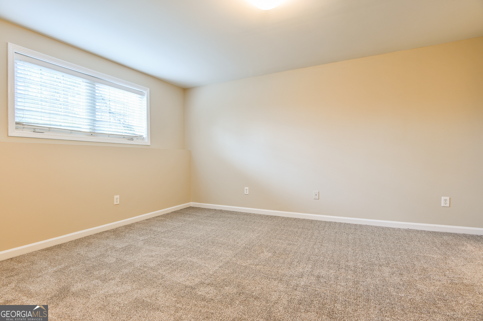 1766 Laurel Ridge Drive Southwest Conyers, GA 30094 - Photo 34 of 61 an empty room with a window
