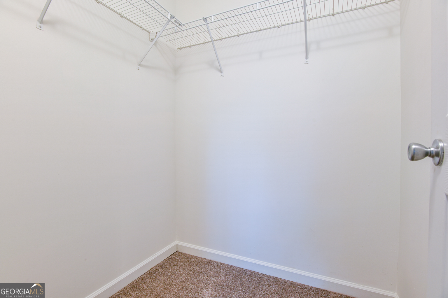 1766 Laurel Ridge Drive Southwest Conyers, GA 30094 - Photo 36 of 61 a view of a small space with racks on the wall