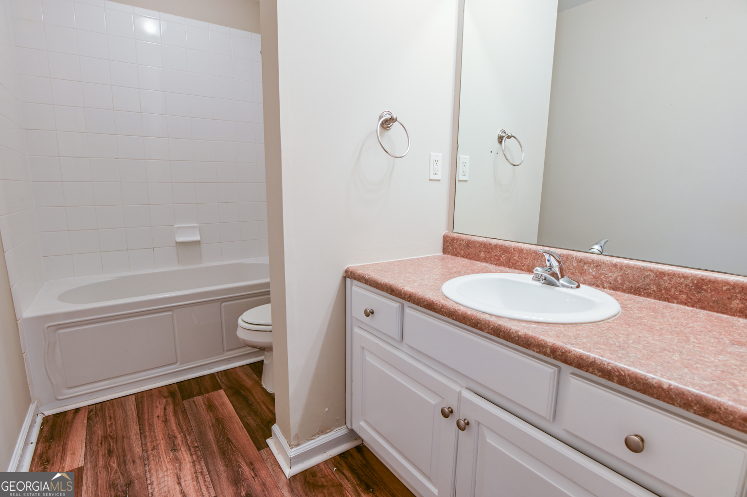 1766 Laurel Ridge Drive Southwest Conyers, GA 30094 - Photo 37 of 61 a bathroom with a sink a toilet and shower