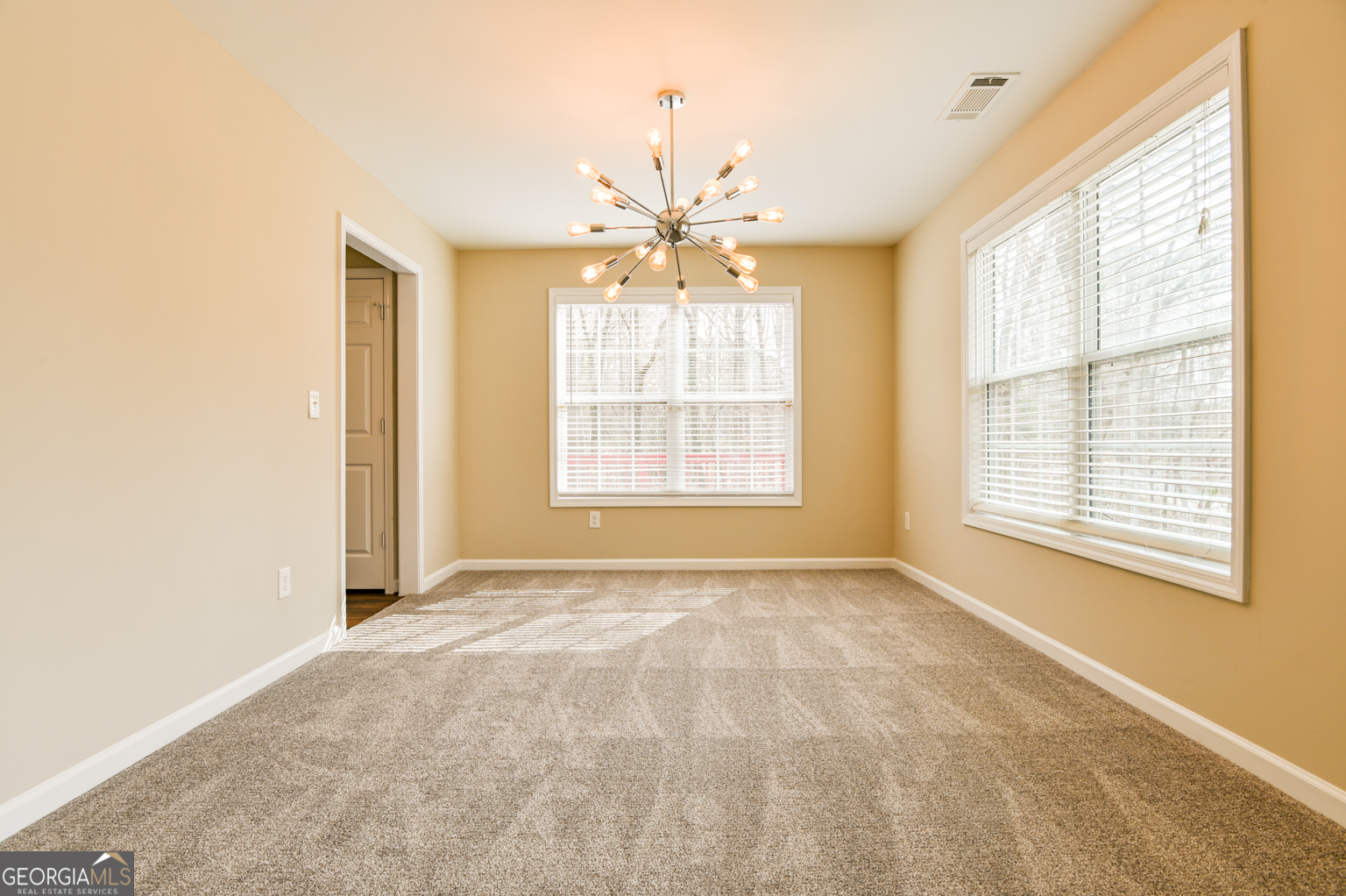 1766 Laurel Ridge Drive Southwest Conyers, GA 30094 - Photo 4 of 61 a view of an empty room with a window