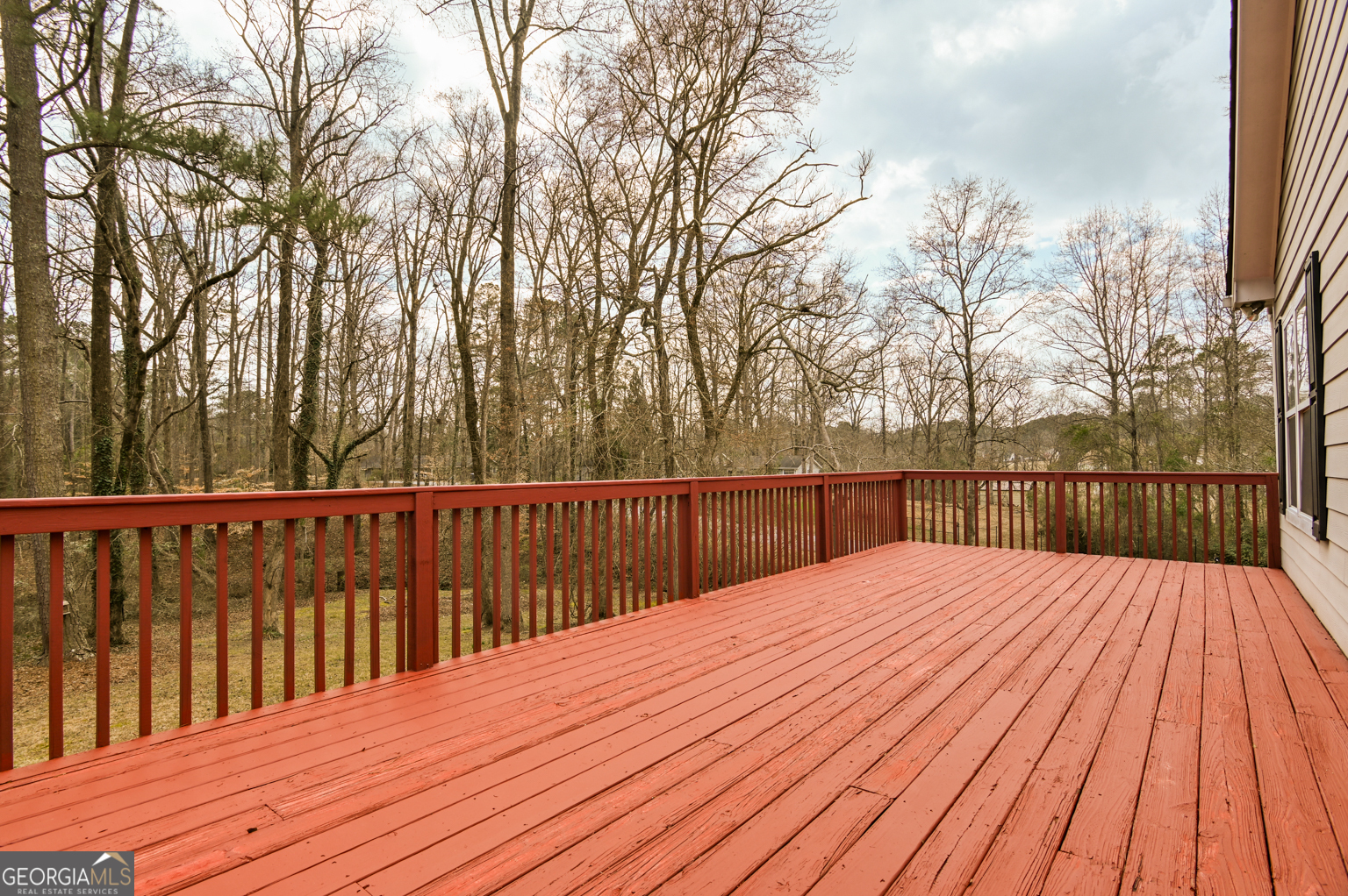 1766 Laurel Ridge Drive Southwest Conyers, GA 30094 - Photo 41 of 61 a balcony with wooden floor and trees