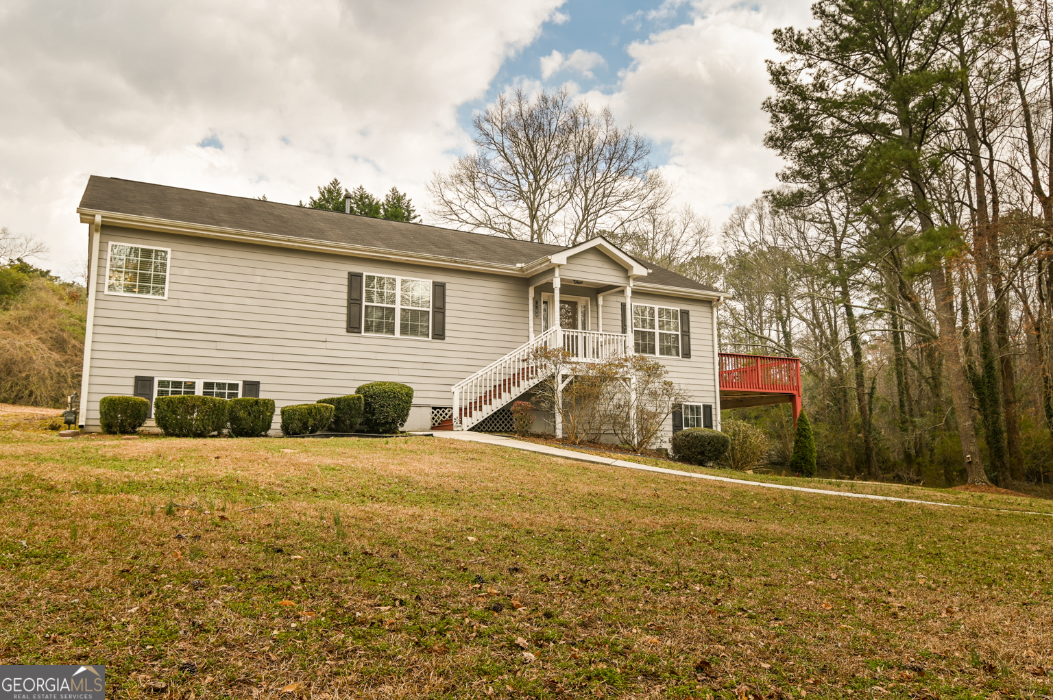 1766 Laurel Ridge Drive Southwest Conyers, GA 30094 - Photo 47 of 61 a front view of a house with a yard and trees