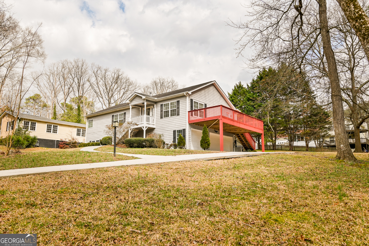 1766 Laurel Ridge Drive Southwest Conyers, GA 30094 - Photo 49 of 61 a front view of a house with a yard and trees