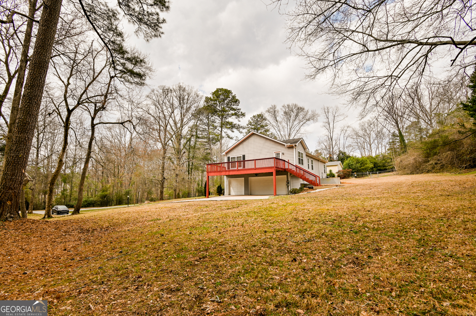 1766 Laurel Ridge Drive Southwest Conyers, GA 30094 - Photo 51 of 61 a front view of a house with a yard covered with snow