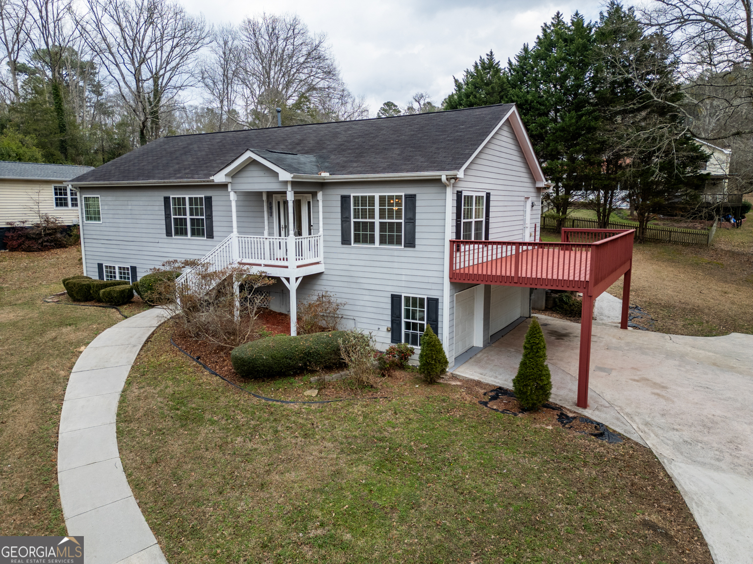 1766 Laurel Ridge Drive Southwest Conyers, GA 30094 - Photo 53 of 61 a view of a house with a yard and sitting area