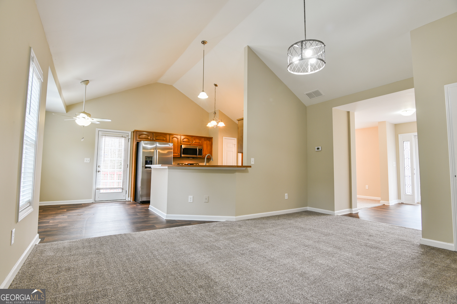 1766 Laurel Ridge Drive Southwest Conyers, GA 30094 - Photo 10 of 61 a view of an empty room and a kitchen