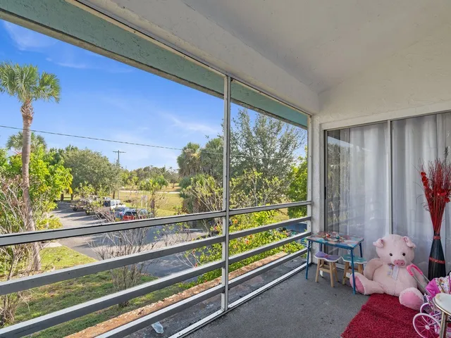 a view of a chairs and table in the patio