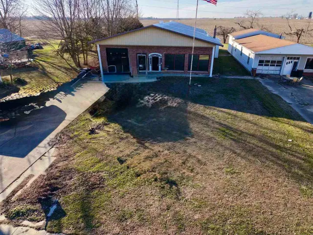 a view of house with yard
