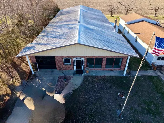 a aerial view of a house with swimming pool
