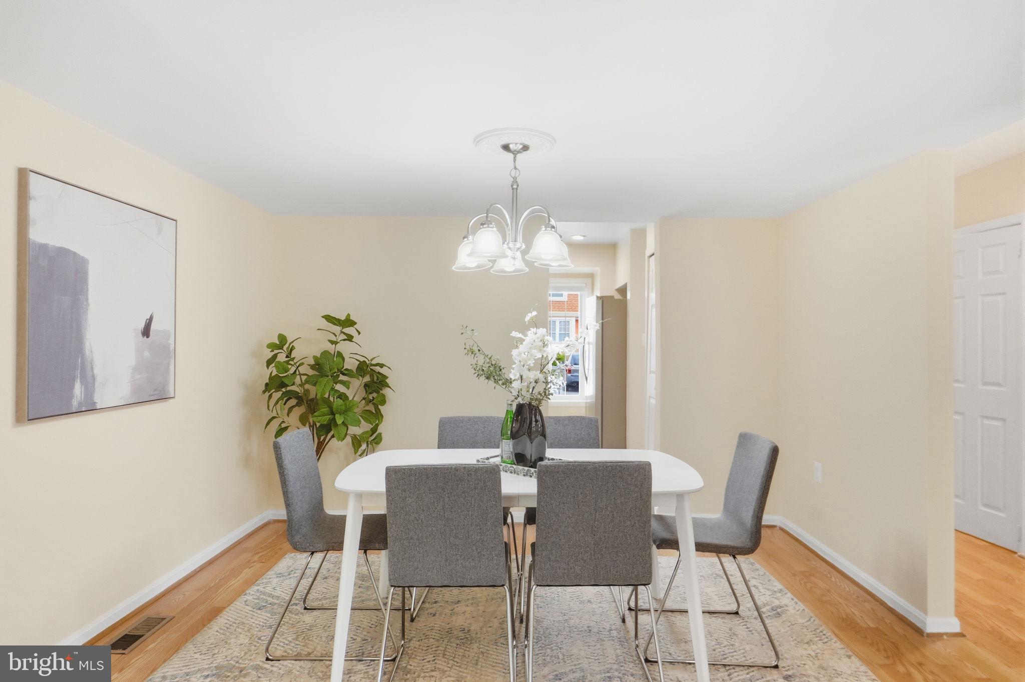 6470 Franconia Court Springfield, VA 22150 - Photo 8 of 31 a dining room with furniture and chandelier