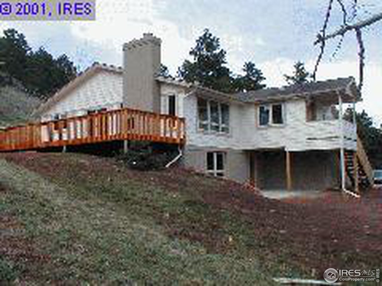 6149 Olde Stage Road Boulder, CO 80302 - Photo 1 of 4 a view of a house with a yard and deck