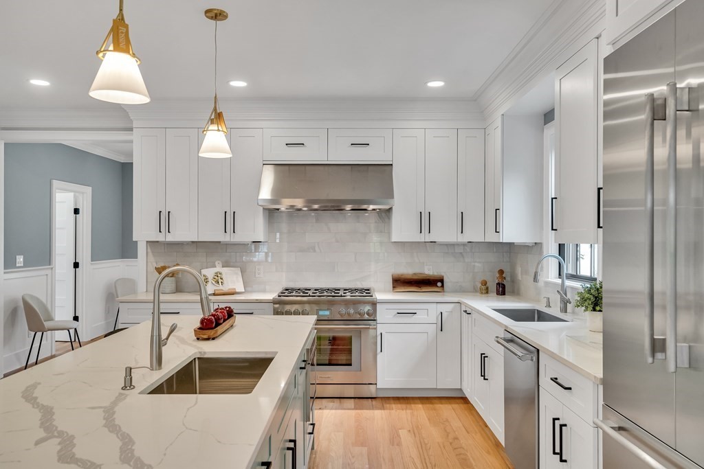 6 Park Street Lexington, MA 02421 - Photo 14 of 42 a kitchen with a sink a stove and cabinets