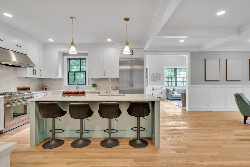 6 Park Street Lexington, MA 02421 - Photo 15 of 42 a kitchen with a sink cabinets and wooden floor