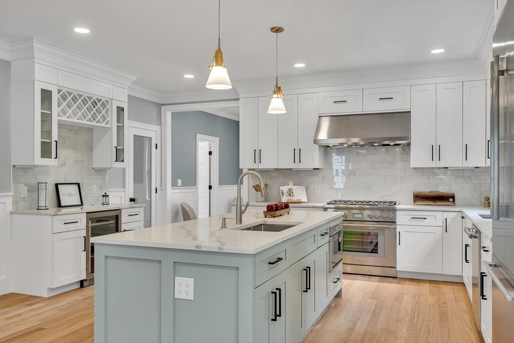 6 Park Street Lexington, MA 02421 - Photo 16 of 42 a kitchen with stainless steel appliances granite countertop a sink stove and refrigerator