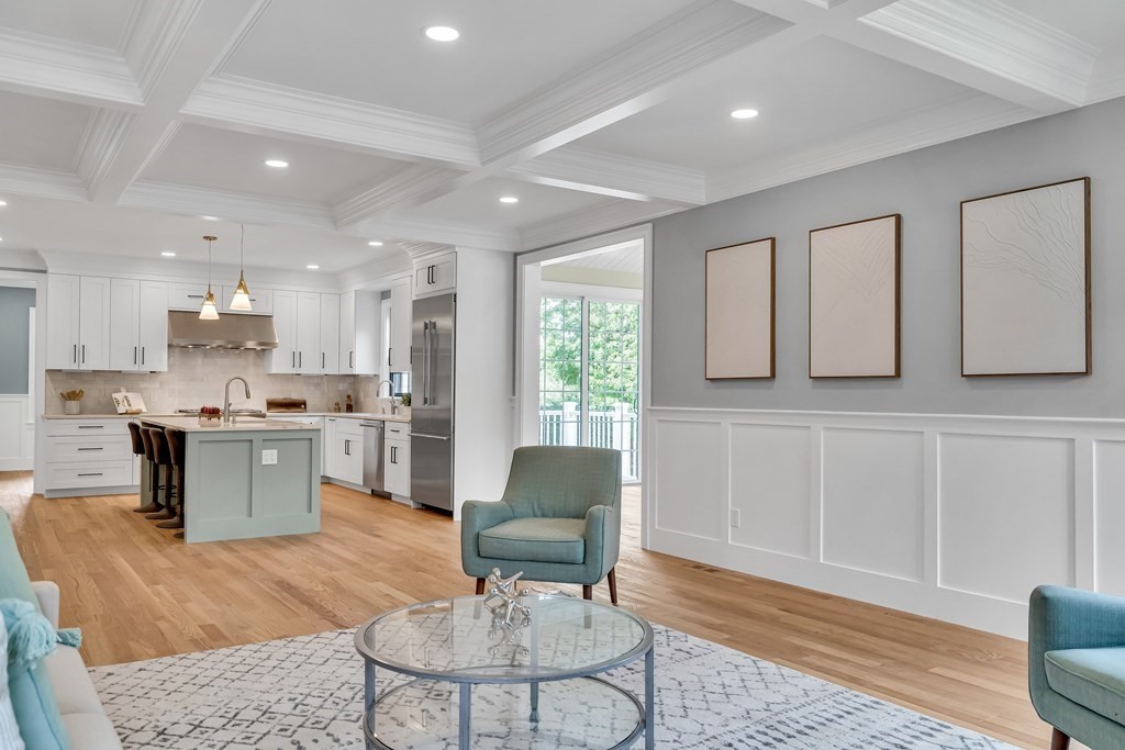 6 Park Street Lexington, MA 02421 - Photo 20 of 42 a living room with kitchen island furniture and a kitchen view