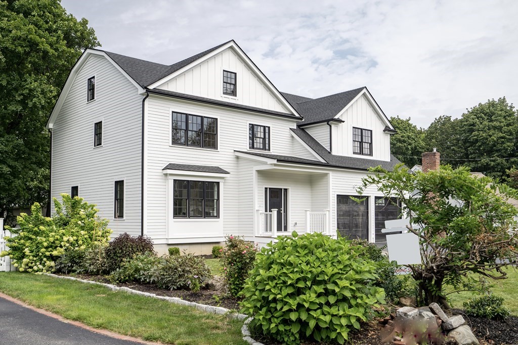 6 Park Street Lexington, MA 02421 - Photo 2 of 42 a view of a white house next to a yard