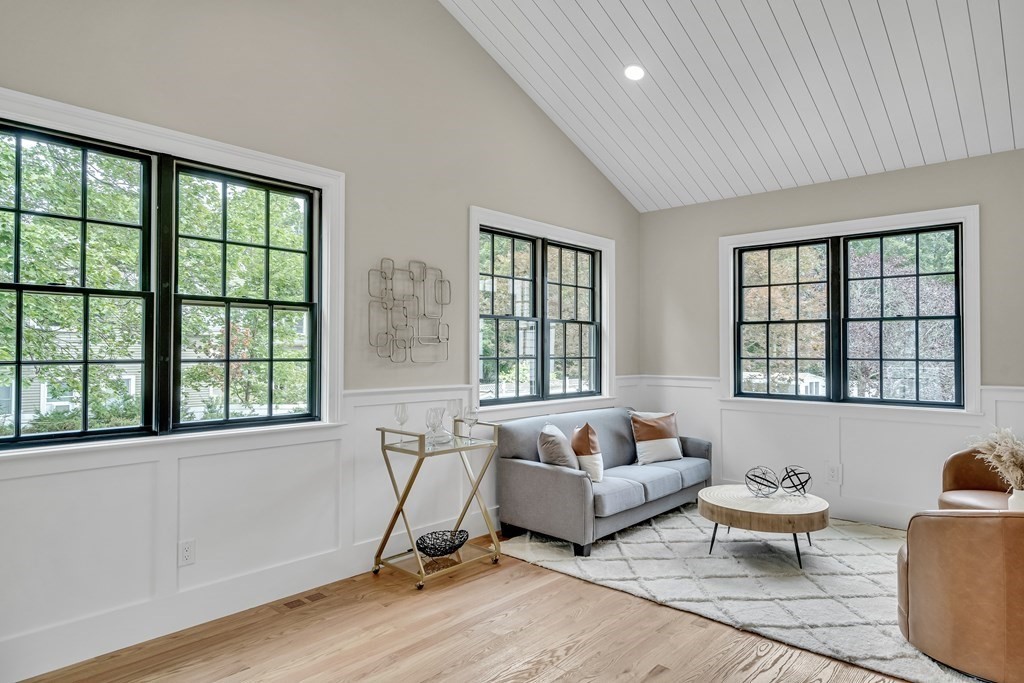 6 Park Street Lexington, MA 02421 - Photo 23 of 42 a living room with furniture and floor to ceiling windows
