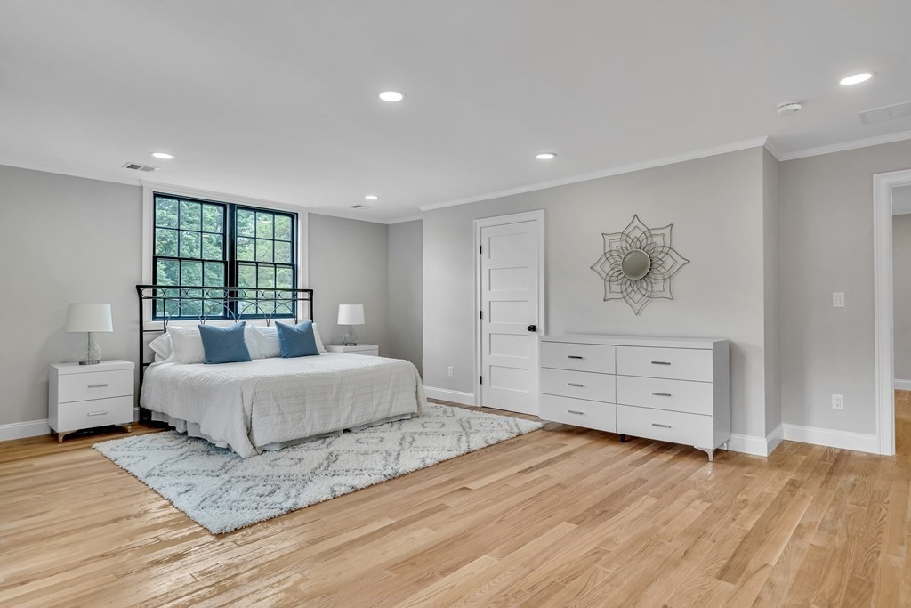 6 Park Street Lexington, MA 02421 - Photo 26 of 42 a spacious bedroom with a large bed and window