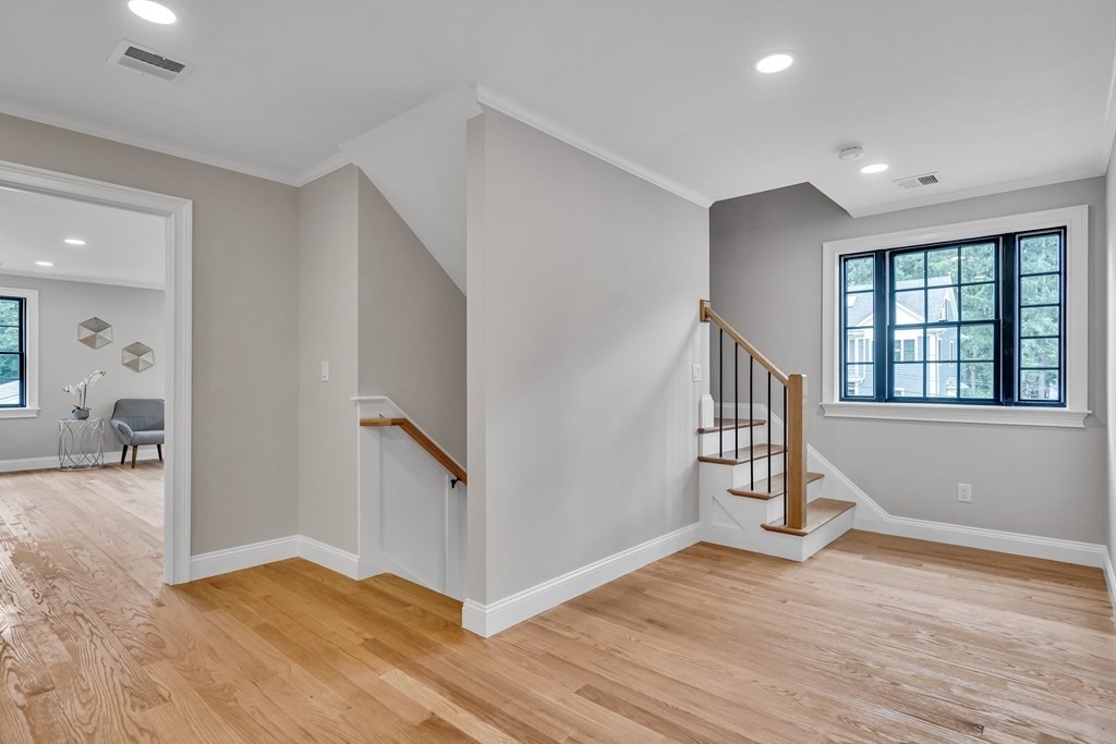 6 Park Street Lexington, MA 02421 - Photo 28 of 42 a view of empty room with wooden floor and fan