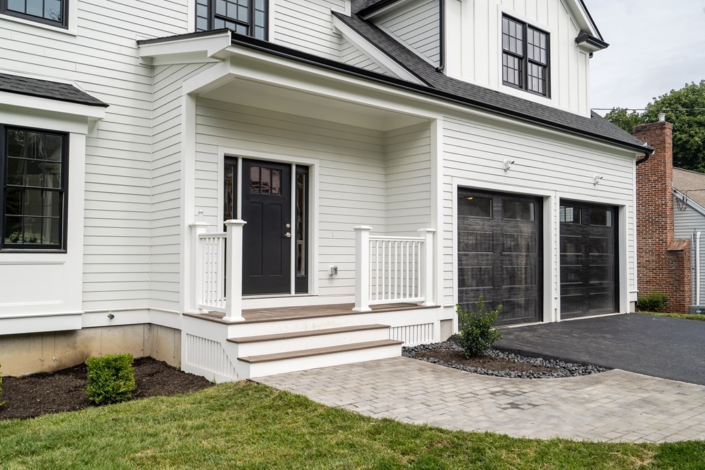 6 Park Street Lexington, MA 02421 - Photo 3 of 42 a front view of a house with a yard