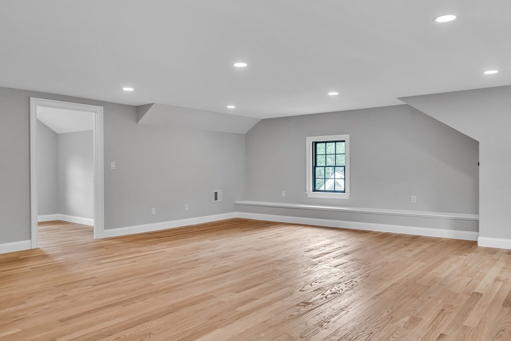 6 Park Street Lexington, MA 02421 - Photo 34 of 42 a view of empty room with wooden floor and fan
