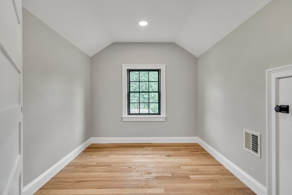 6 Park Street Lexington, MA 02421 - Photo 35 of 42 a view of empty room with wooden floor and fan
