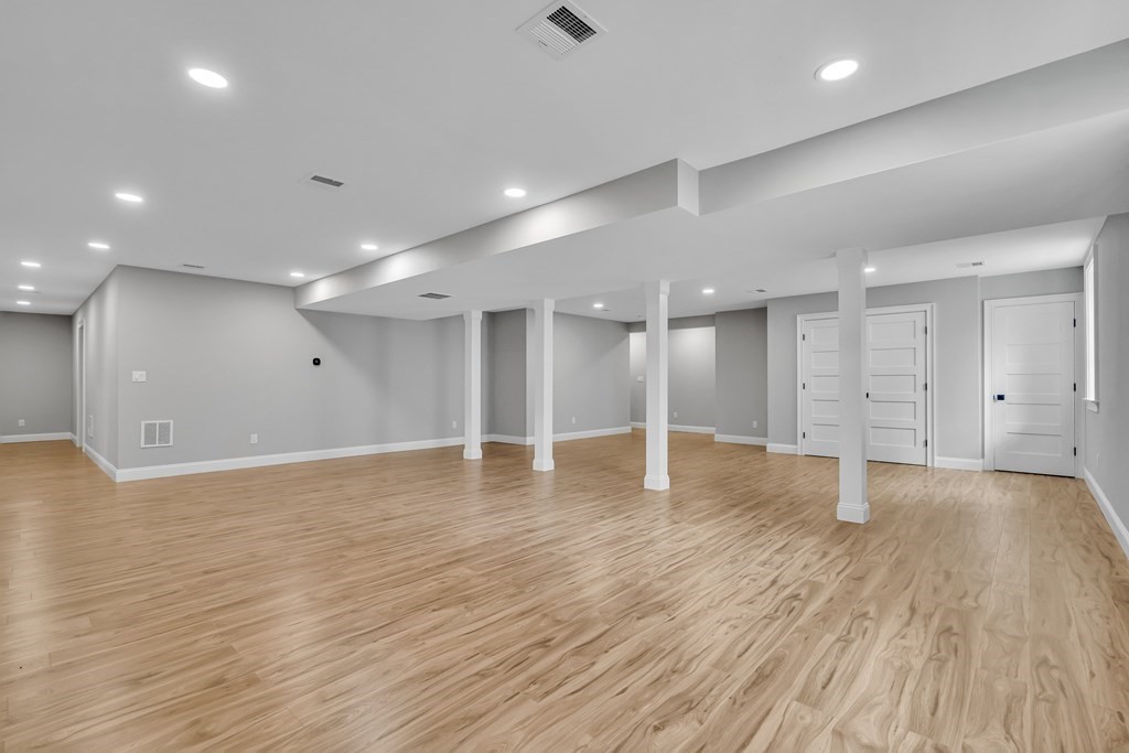 6 Park Street Lexington, MA 02421 - Photo 37 of 42 a view of an empty room with wooden floor