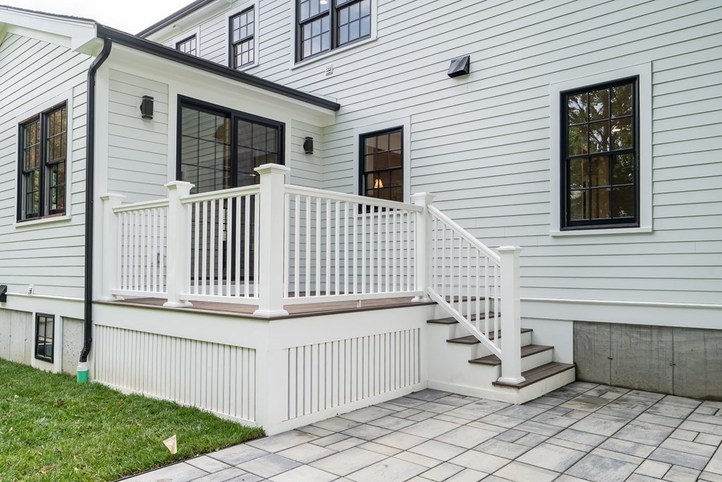 6 Park Street Lexington, MA 02421 - Photo 39 of 42 a view of a house with a small yard and wooden floor and fence