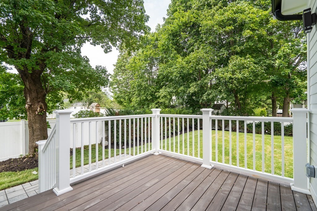 6 Park Street Lexington, MA 02421 - Photo 40 of 42 a view of balcony with wooden floor and fence