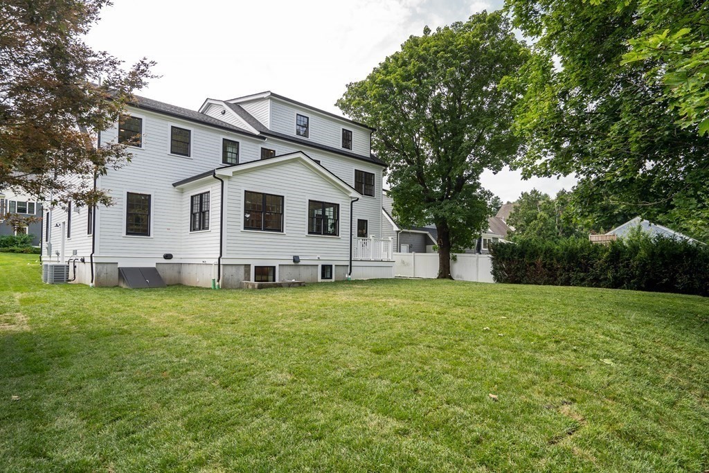 6 Park Street Lexington, MA 02421 - Photo 41 of 42 a front view of a house with a garden