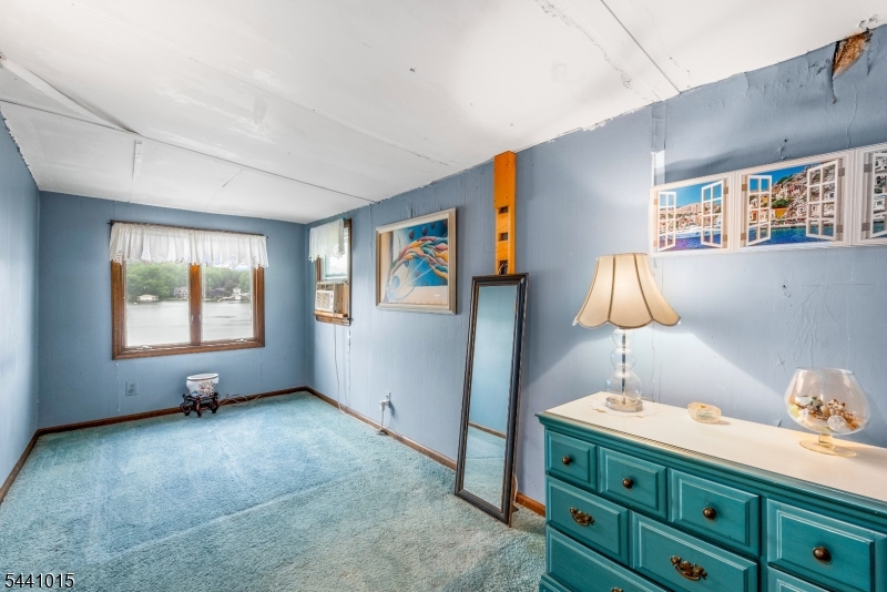 308 Lakeside Avenue Hopatcong, NJ 07821 - Photo 8 of 13 a room with furniture and a window