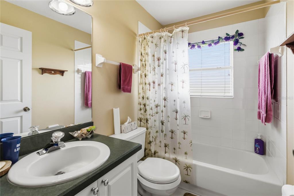 3225 Canoe Creek Road St. Cloud, FL 34772 - Photo 16 of 30 a bathroom with a sink toilet and shower