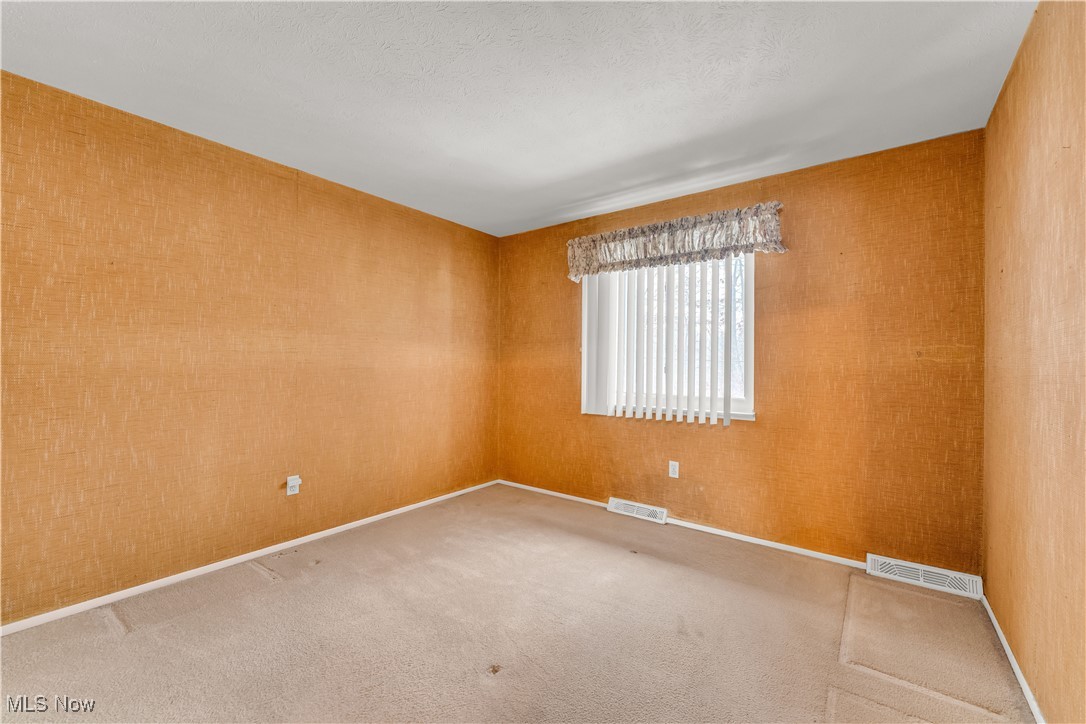 6470 State Road, Unit K5 Parma, OH 44134 - Photo 19 of 26 Spare room featuring carpet and baseboards
