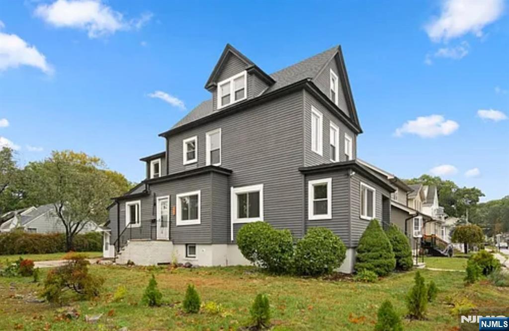 57 Byrne Street, Unit 1 Hackensack, NJ 07601 - Photo 15 of 16 a front view of a house with a yard