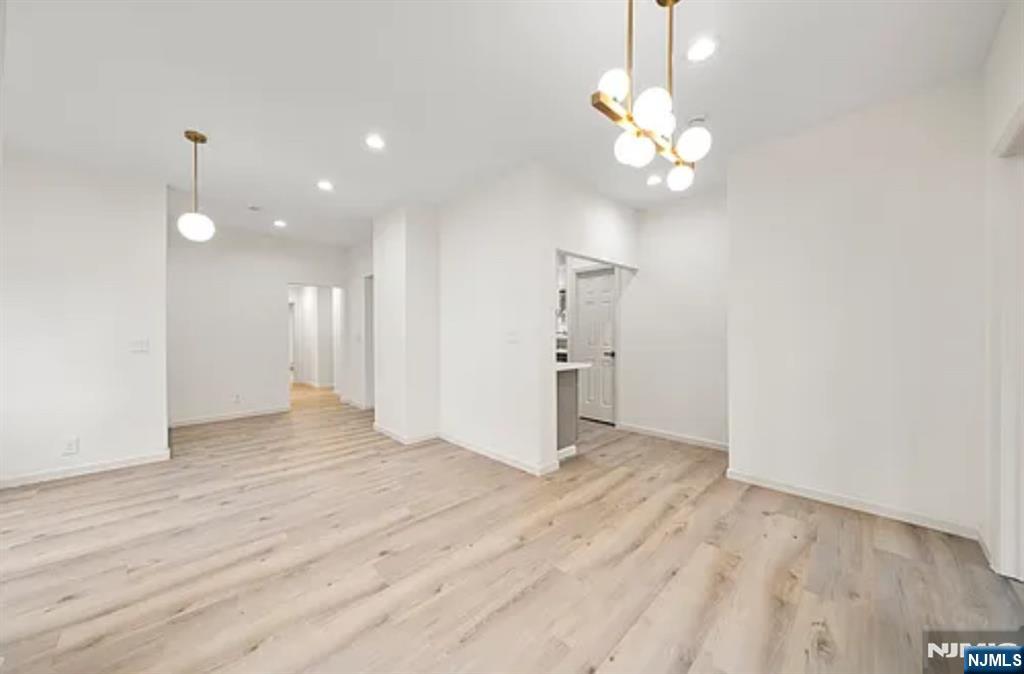 57 Byrne Street, Unit 1 Hackensack, NJ 07601 - Photo 4 of 16 a view of a livingroom with a chandelier