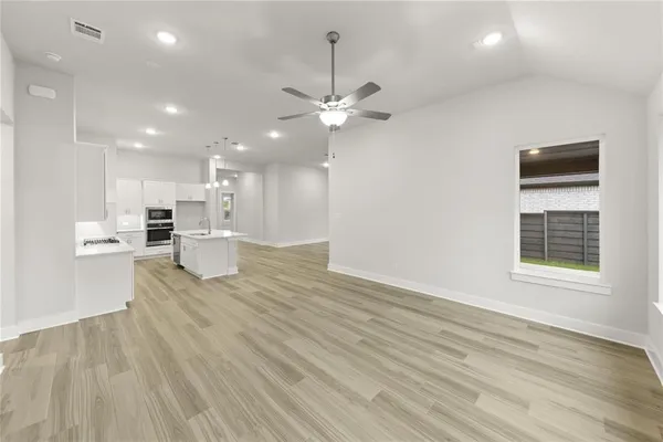 a view of kitchen with wooden floor