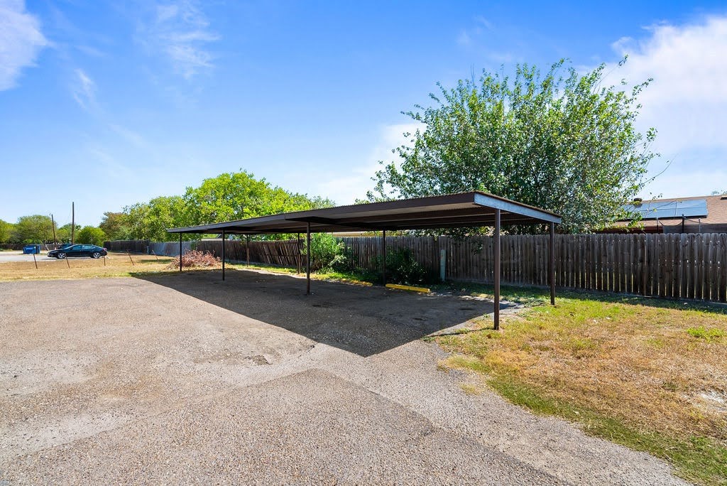 1410 Moore Avenue Portland, TX 78374 - Photo 16 of 17 a swimming pool with wooden fence